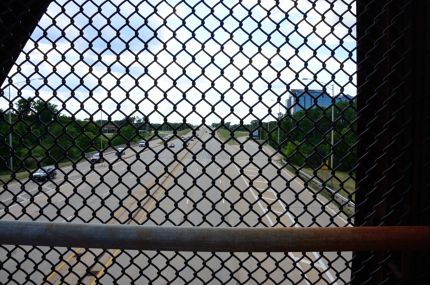 The fenced in bridge view of county line road